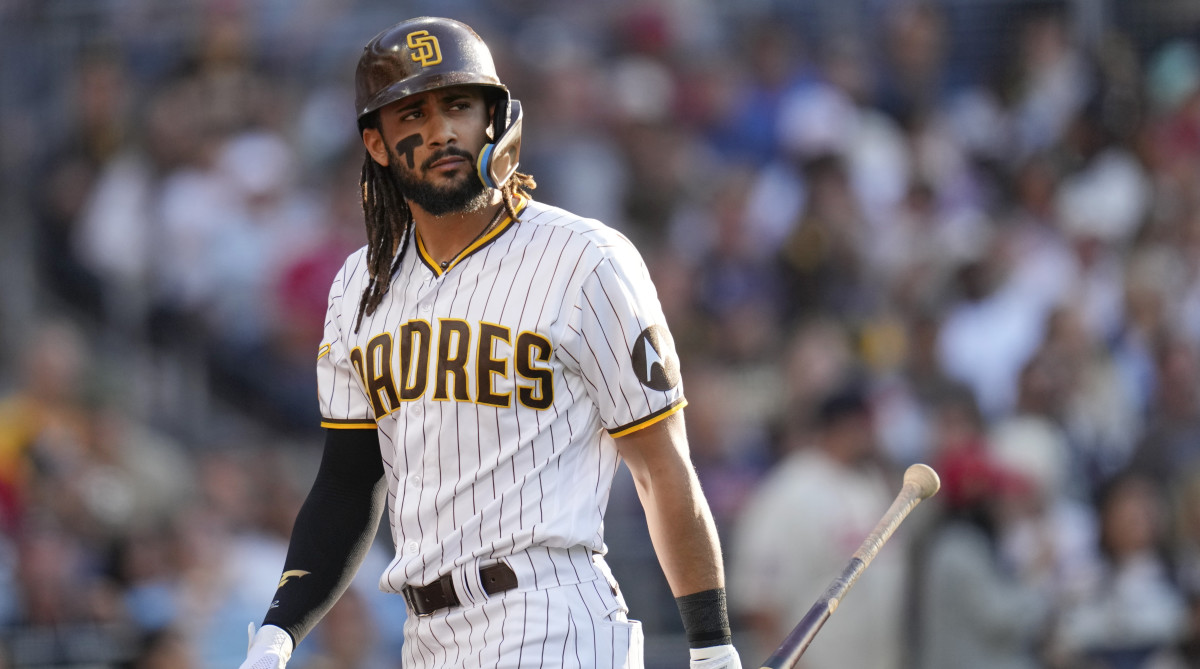 San Diego Padres’ Fernando Tatis Jr. walks back to the dugout after striking out.